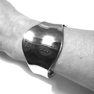 Silver toned hinged statement bracelet